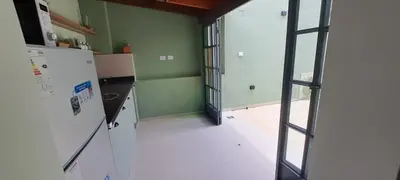 a kitchen with a refrigerator and an open door at Mozzafiato in Cordoba
