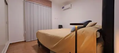 a bedroom with a bed and a lamp in it at Mozzafiato in Cordoba