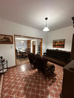 a living room with a couch and chairs in it at Casa del centro in Villa del Dique