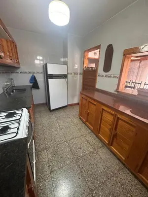 a kitchen with a white refrigerator and a stove at Casa del centro in Villa del Dique