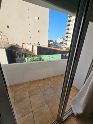 a balcony with a view of a city at La Rioja Apartamento in Cordoba