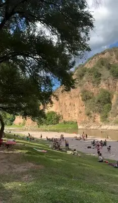 a group of people on a beach near a mountain at Mirador Rest House - Casa entera con pileta privada in Bialet Massé