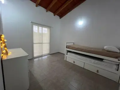 a white room with a bed and a window at Mirador Rest House - Casa entera con pileta privada in Bialet Massé