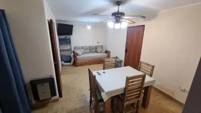 a living room with a table and chairs and a couch at centro apartment in Cordoba