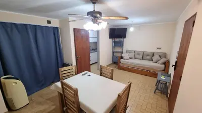 a living room with a table and a couch at centro apartment in Cordoba