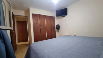 a bedroom with a bed and a phone in a room at centro apartment in Cordoba