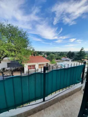 a view from the balcony of a house with a green fence at Marisa departamento temporario in Villa Carlos Paz