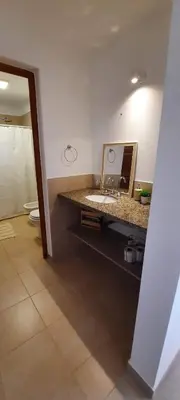 a bathroom with a sink and a mirror at Casa de Campo Roca - Exclusivo para Parejas in Villa Cura Brochero