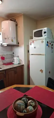 a kitchen with a table with a bowl of eggs at Departamento Balcarce 455 in Cordoba