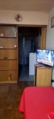 a living room with a computer on top of a table at Departamento Balcarce 455 in Cordoba