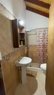 a bathroom with a sink and a toilet at Gran aldea in Mina Clavero