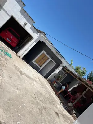 a man standing in the front of a house at La soñada AG in Alta Gracia