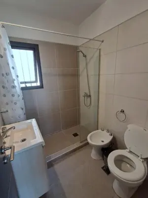 a bathroom with a toilet and a shower and a sink at Mis tres estrellas 2 in Cavalango