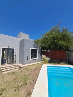 a house with a swimming pool in front of it at Mis tres estrellas 2 in Cavalango