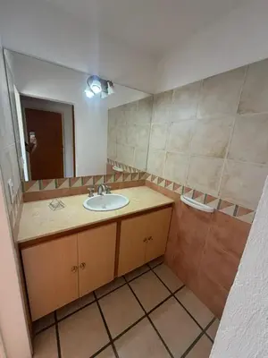a bathroom with a sink and a mirror at Casa Mabel in La Porteña