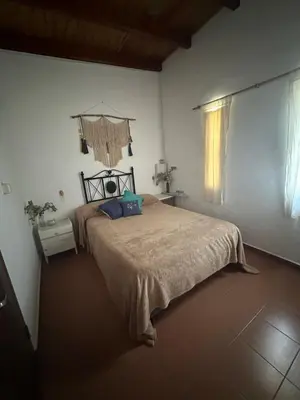a bedroom with a large bed in a room at Mi lugar Potrero de Garay in La Estancia