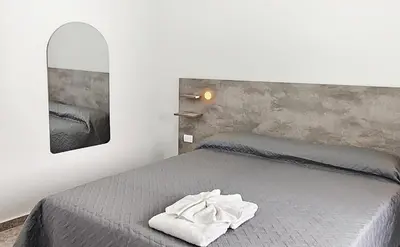 a bedroom with a bed with a towel on it at new bv carlos paz in Villa Carlos Paz
