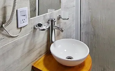 a bathroom with a white sink and a mirror at new bv carlos paz in Villa Carlos Paz