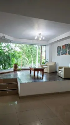 a living room with a couch and a table at Departamento 2 H VIRREY in Villa Carlos Paz