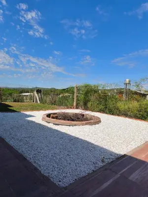a fire pit in the middle of a gravel road at Casa de campo Los Gurises in Alta Gracia