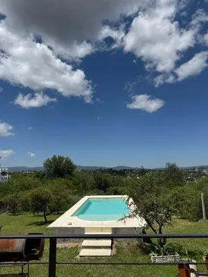 a view of a swimming pool from a balcony at El Parador de Tanti in Tanti