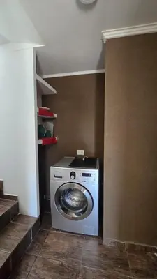 a washer and dryer in a small room at La Soñada in San Roque