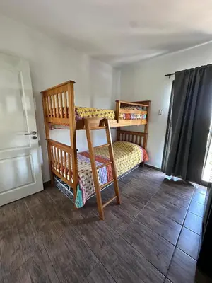 a bedroom with two bunk beds in a room at La Soñada in San Roque