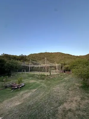 a field with a fence on top of a hill at La Soñada in San Roque