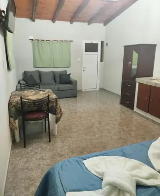 a living room with a couch and a table at Monoambiente Pilu in Villa Cura Brochero