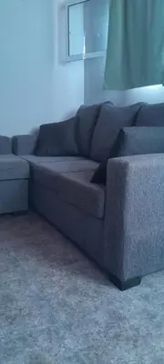 a blue couch sitting in a living room at Monoambiente Pilu in Villa Cura Brochero