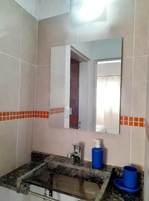 a bathroom with a sink and a mirror at Brisas de las Sierras 2 in Tanti