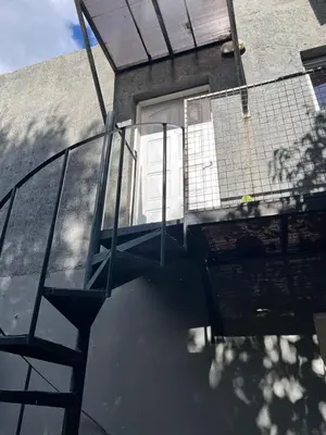 a glass deck with a door on a house at Siempre verde1 in El Rincón