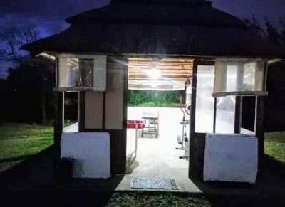 a small house at night with a light at Casa grande Flor Silvestre in Carpintería