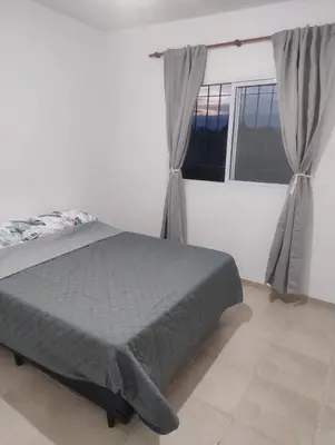 a bedroom with a bed and a window at Rincon de Olivares in Los Olivares