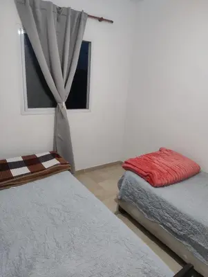 a bedroom with two beds and a window at Rincon de Olivares in Los Olivares