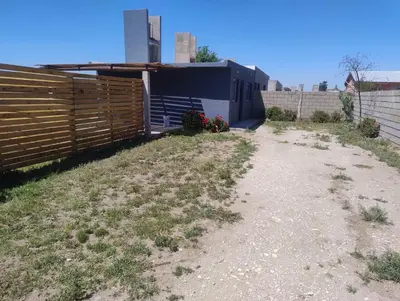 a dirt road in front of a fence at Rincon de Olivares in Los Olivares
