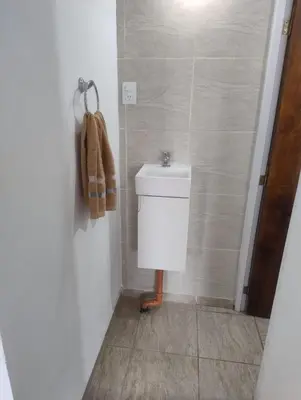 a bathroom with a toilet and a sink at Rincon de Olivares in Los Olivares