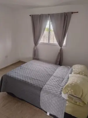 a bed in a bedroom with a window at Rincon de Olivares in Los Olivares