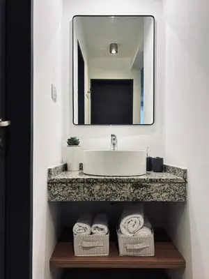 a bathroom with a sink and a mirror at Departamento luminoso y acogedor en Alberdi in Cordoba