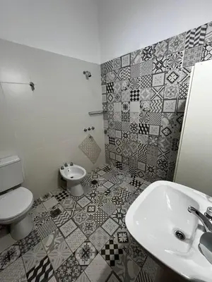 a bathroom with a sink and a toilet at Cabañas Refugio del Alma in Villa Amancay