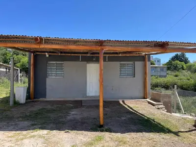 a building with a metal roof on top of it at La casita de Nestor in Cavalango