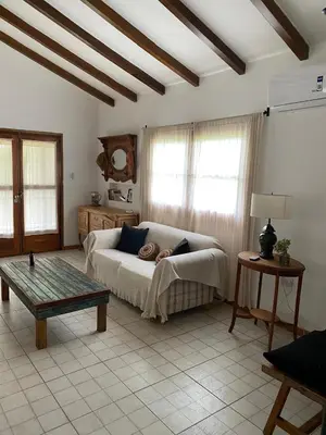 a living room with a couch and a table at Casa de Campo in Los Hornillos