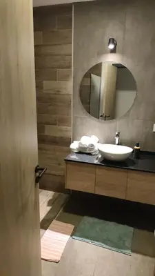 a bathroom with a sink and a mirror at depto carlos paz in Villa Carlos Paz