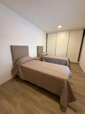 a bedroom with two beds in a room at depto carlos paz in Villa Carlos Paz