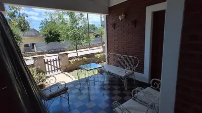 a balcony with two chairs and a table on a patio at 