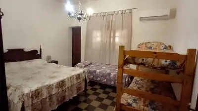 a bedroom with a bed and a chair in it at 