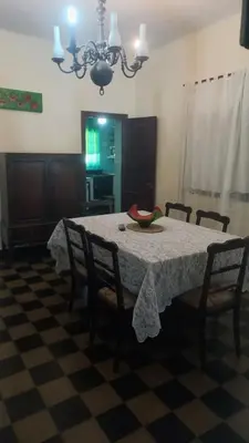a dining room with a table with a bowl on it at 
