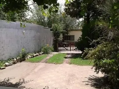 a house with a fence and a driveway at 