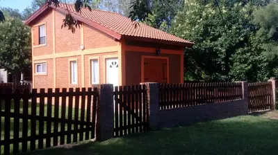 a small house with a fence in front of it at Doña Elba in Merlo