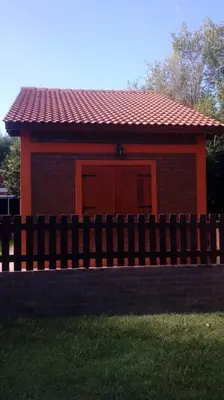 a small house with a fence in front of it at Doña Elba in Merlo